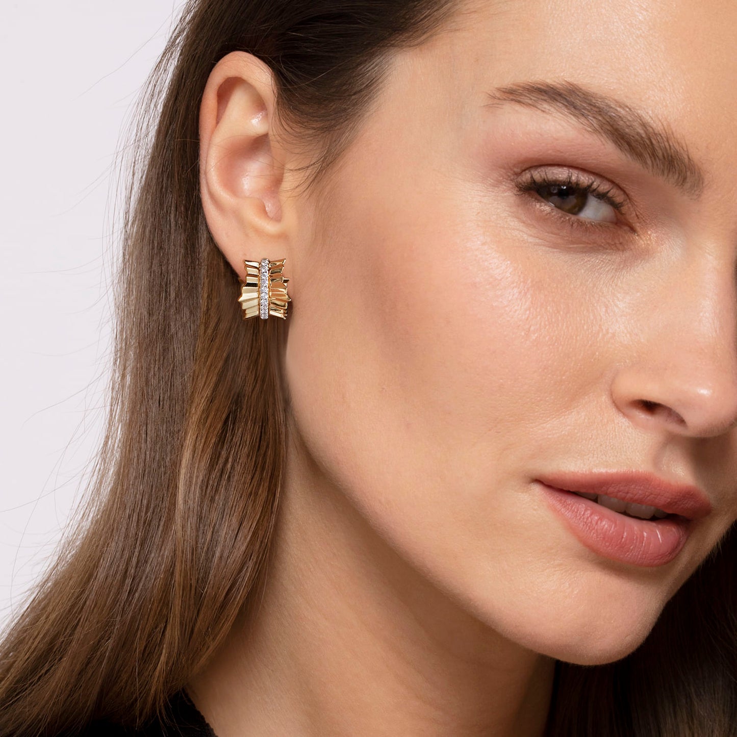 14K Yellow Gold Diamond Huggie in size 15mm with Diamond Cut Texture